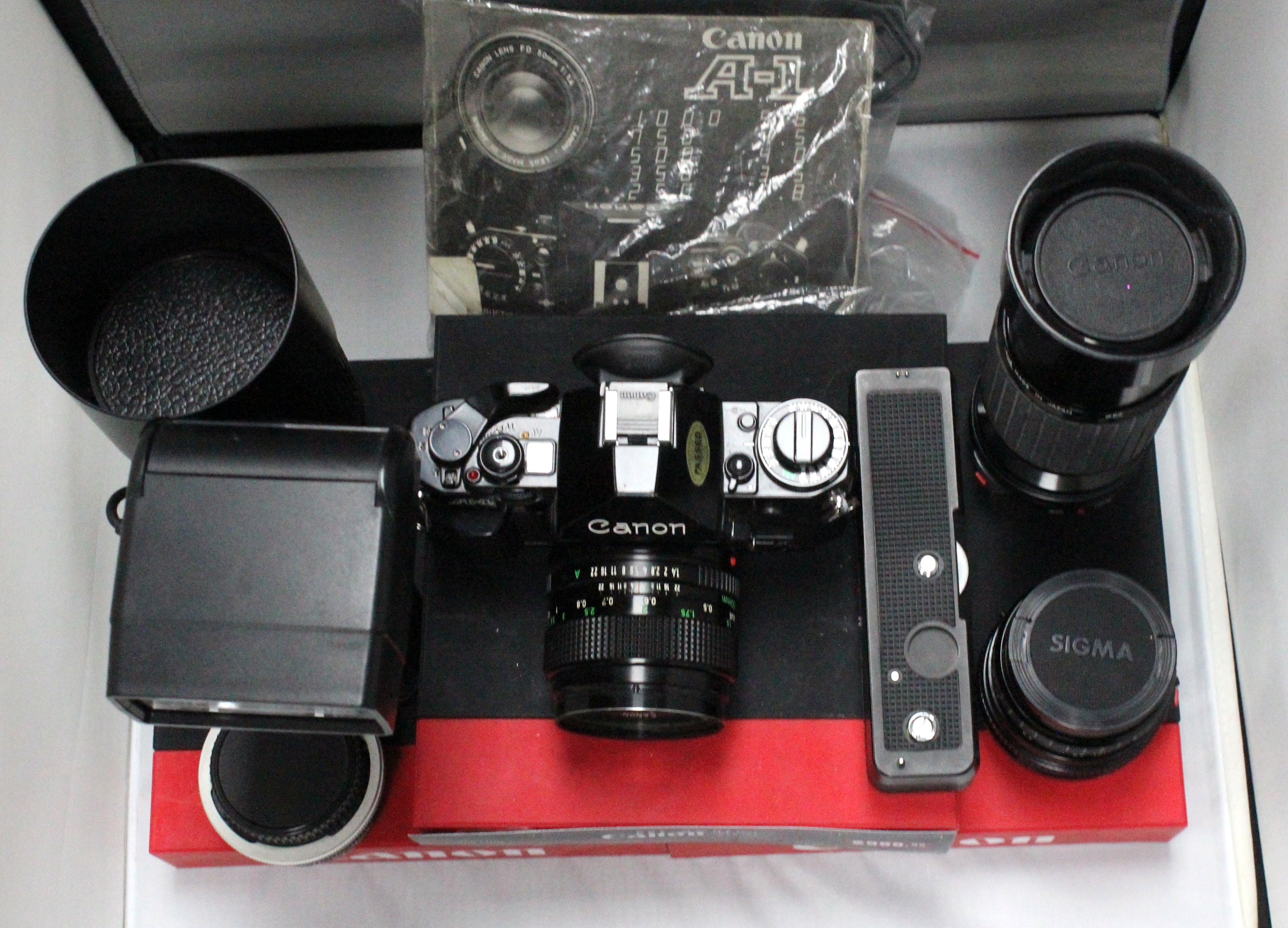 (Pre-Owned) Canon A1 Body with Lenses, Teleconverter plus Accessories